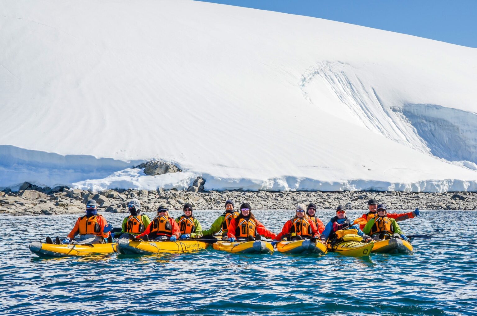 group of people kayaking antarctica