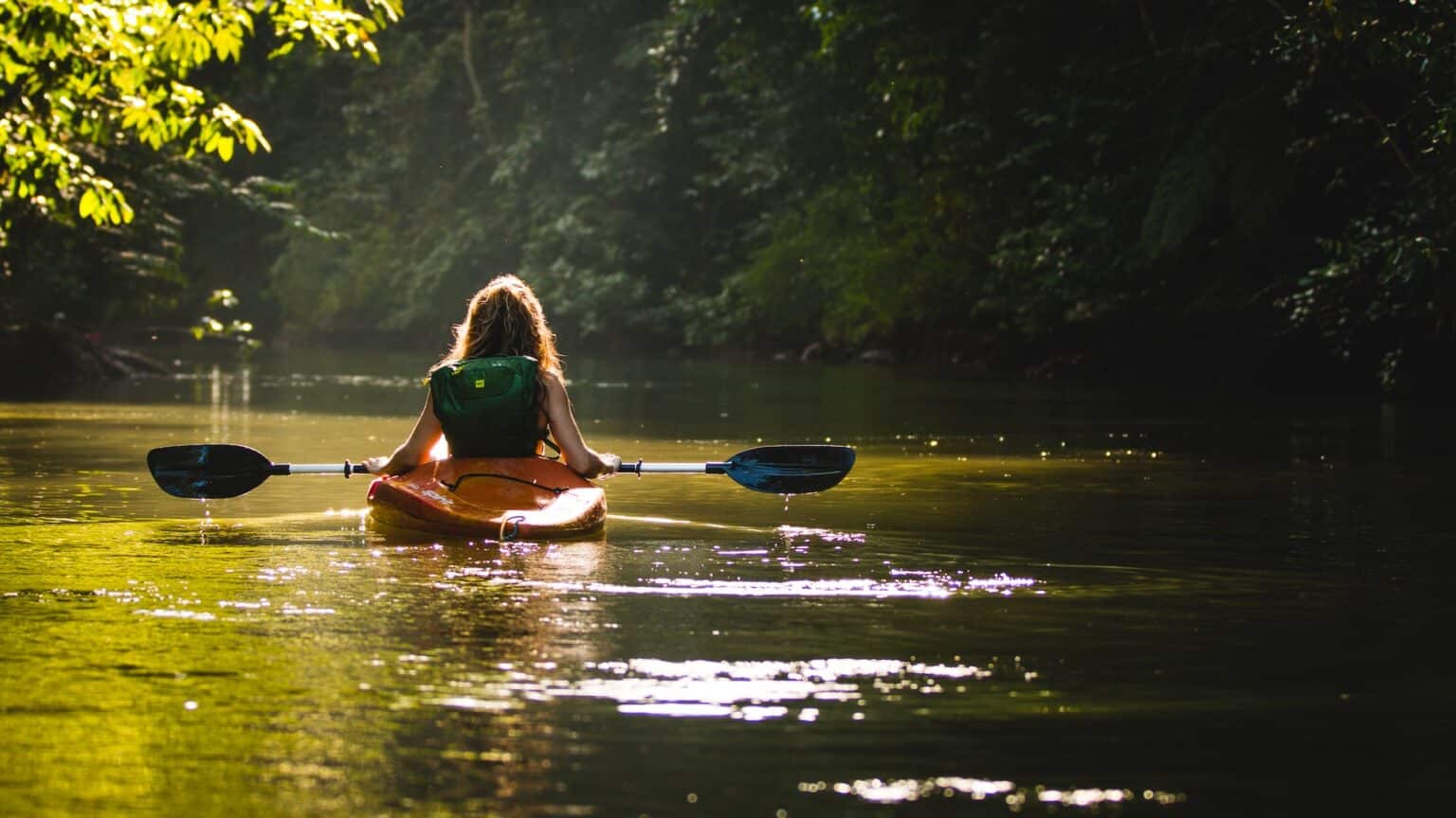women kayaking in tranquil river, drake bay costa rica